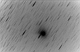 Kometa C/2014 E2 Jacques. Obraz negatywowy, z widocznym słabym warkoczem gazowym. Parametry: 2014.08.26.00:14-00:55CWE. Reflektor Newtona 205/907+MPCC+N.D300. Exp.7x120sek. 4x170sek. ISO1600.