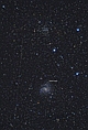 14 maja 2017 roku w galaktyce NGC - 6946 została odkryta jasna supernowa SN2017eaw, typu II. W przerażającym akcie zniszczenia eksplodowała wielka gwiazda a jej blask niemal dorównał jasności całej galaktyki w której wybuchła. W istocie wydarzenie to miało miejsce 22 miliony lat temu, gdyż światło potrzebowało tyle czasu by dotrzeć z NGC - 6946 do Ziemi. W górnej części fotografii znajduje się gromada otwarta NGC - 6939 a z lewej ślad pozostawiony przez sztucznego satelitę Ziemi.Parametry: 2017.05.18-19.23:55-00:34CWE. Newton 205/907+MPCC+N.D300. Exp.4x240sek. ISO1600.  
