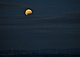 Częściowe zaćmienie Księżyca. Zdjęcie wykonane z góry Przylaski w Zręcinie. W dole elektrownia wiatrowa w Rymanowie.2017.08.07.2O:19CWE 