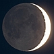 Popielate światło Księżyca w fazie 3 doby po nowiu. Parametry: 2014.04.02.19:59CWE. Reflektor Newtona 250/1520 + Nikon D300,w ognisku głównym teleskopu. Exp.2sek. ISO320.