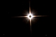 Księżyce Marsa, Phobosa i Deimosa odkrył Alseph Hall w 1877 roku przy pomocy 65 - centymetrowego refraktora United 
States Naval Observatory. Obiekty te, o rozmiarach ok. 27 i 12 kilometrów uchodzą za najtrudniej obserwowalne ciała 
niebieskie Układu Słonecznego. Nie wynika to bynajmniej z ich małych jasności lecz z olbrzymiego blasku samego Marsa, 
który skutecznie je przyćmiewa. Wizualnie udało mi się je dostrzec przez teleskop Newtona 250/1520  w czasie wielkiej 
opozycji w 2003 roku, co uznaję za jedną z ważniejszych moich obserwacji. Do jej powodzenia przyczyniła się mała przysłona zamontowana w ognisku okularu, która blokowała światło jasnego Marsa. 27 kwietnia 2014 roku podjąłem próbę fotograficznej rejestracji tych księżyców, korzystając z tego samego teleskopu. Phobos (11,8mg) pozostał w blasku planety. O godzinie 21:35 znajdował się w odległości 12 sekund kątowych od krawędzi tarczy Marsa (-1,2mg) a skrócone ekspozycje obniżające jasność planety były niewystarczające do zarejestrowania księżyca. Deimosa (12,9mg) udało się sfotografować - oznaczony na zdjęciu. O 21:35 satelita znajdował się w odległości 40 sekund kątowych od krawędzi tarczy Marsa. Fotografia jest składanką pokazującą Deimosa i poprawnie naświetlony obraz samego Marsa. Parametry:2014.04.27.21:42 -21:55CWE.Reflektor Newtona 250/1520 + Nikon D300, w ognisku głównym teleskopu. Exp. 1x5sek. ISO1000, 1x1/160sek., 1x1/200sek. ISO200.